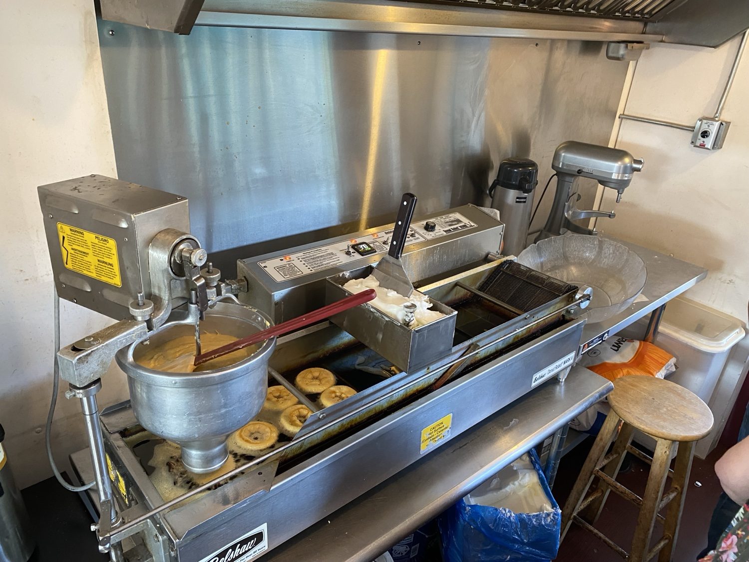The Donut Robot frying fresh donuts